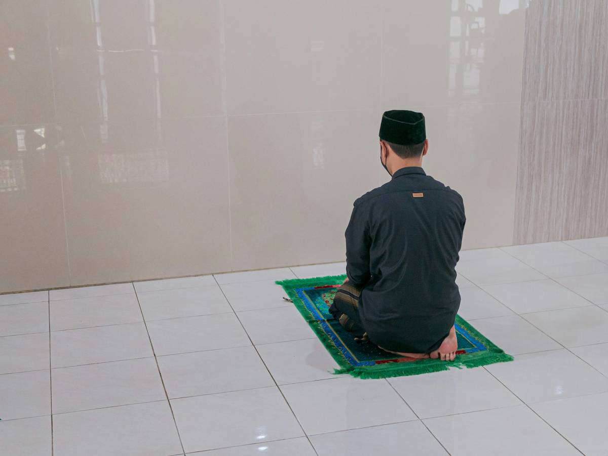 Woman meditating with smartphone app