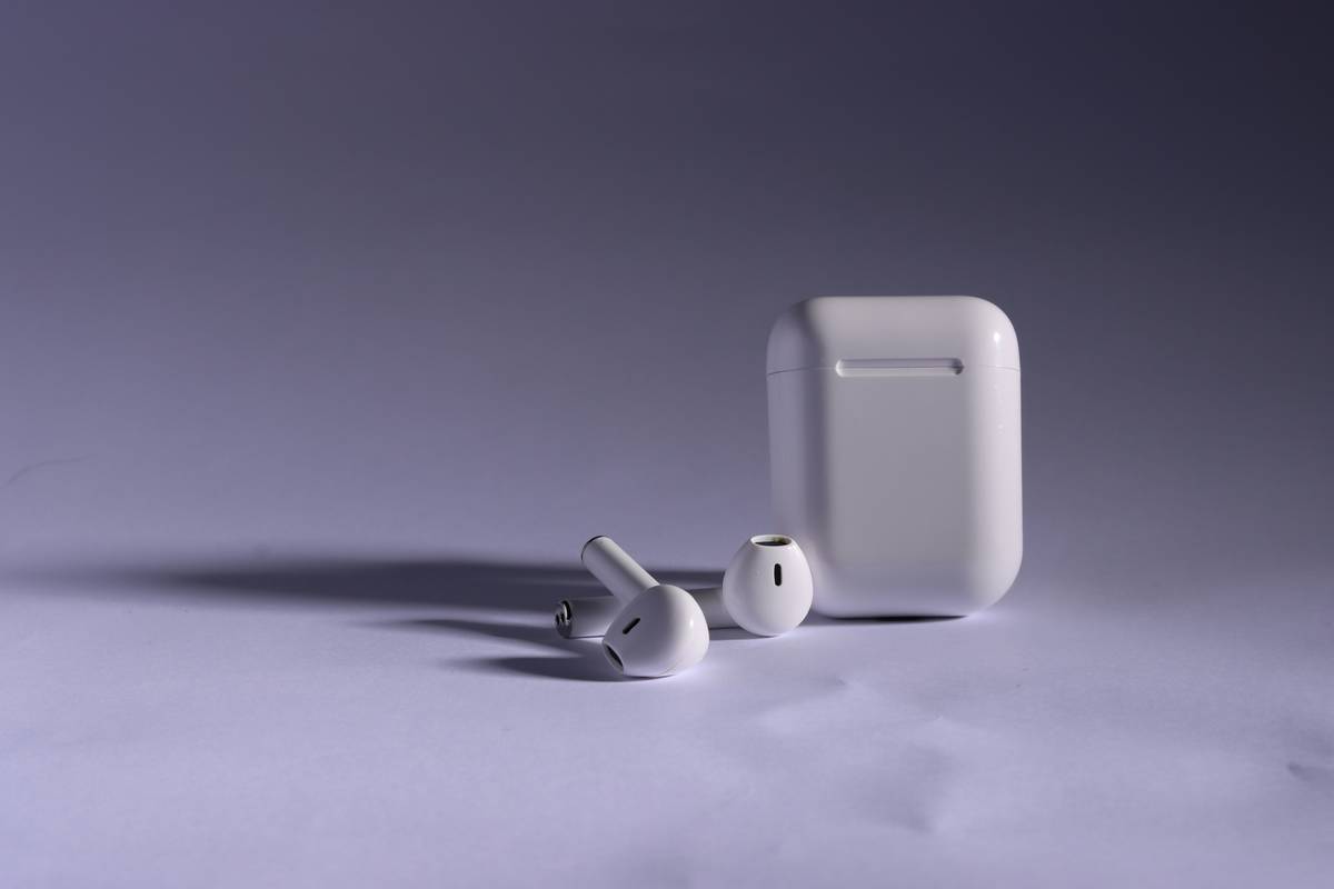 A small, portable mini relaxation robot resting on a desk next to a cup of coffee, perfect for managing daily stress.