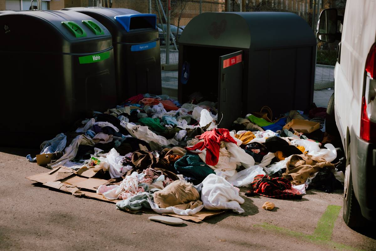 A pile of trash sitting next to a white van